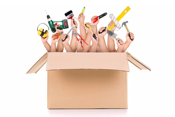 Hands inside a cardboard box — Stock Photo, Image
