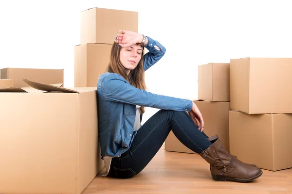 Tired girl with boxes — Stock Photo, Image