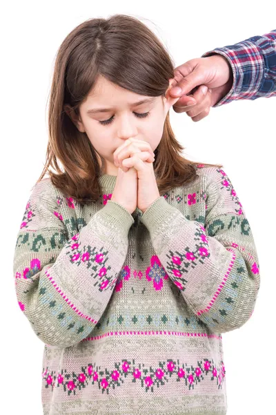 Girl being punished with ear pulling — Stock Photo, Image