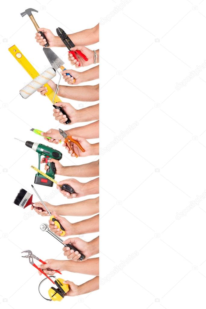 Hands with construction tools