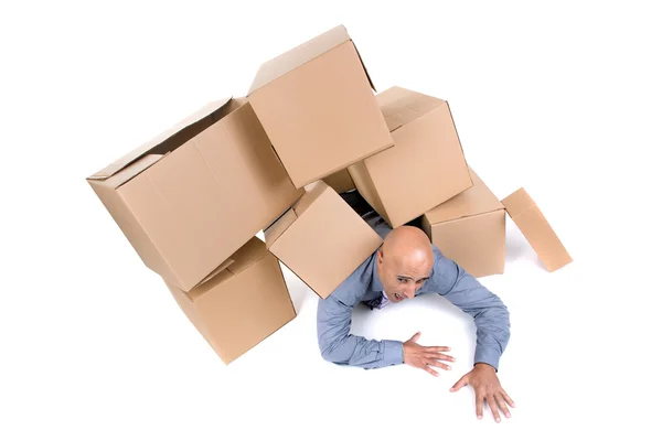 Businessman under boxes — Stock Photo, Image