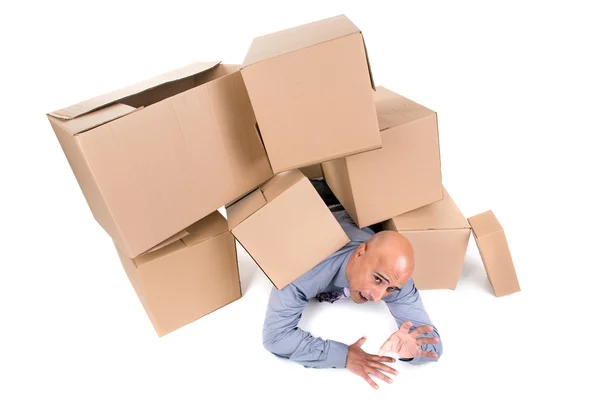 Businessman under boxes — Stock Photo, Image