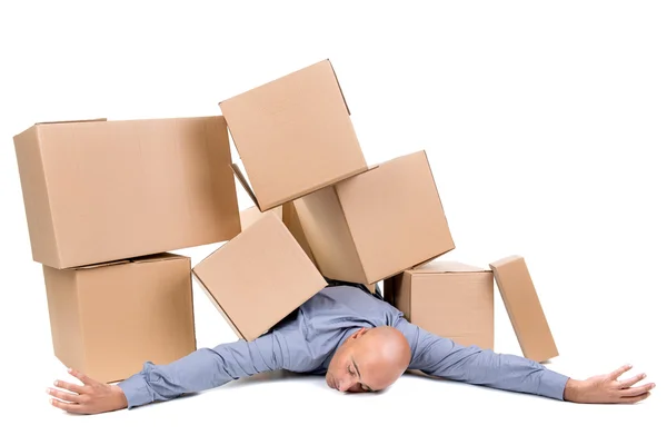 Businessman under boxes — Stock Photo, Image