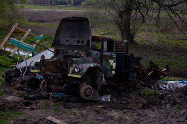 Kolychevka, Ivanovka, Chernihiv region - Apr 2022: War Ukraine Russia. The ruins of the house after the bombing by the Russian army. Destroyed tank and house after a missile attack. 