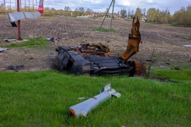 Kolychevka, Ivanovka, Chernihiv region - Apr 2022: War Ukraine Russia. The ruins of the house after the bombing by the Russian army. Destroyed tank and house after a missile attack. 