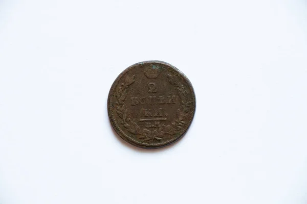 Copper coin of the Russian Empire 2 kopecks 1812 on a white background, old coin