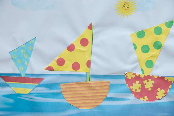 children\'s drawing, paper applique ships on the water, children\'s boats in the sea, children\'s creativity, drawing