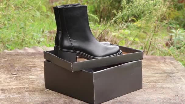 Black High Women Boots Thick Soles Girl Pulls Out Box — Stock Video