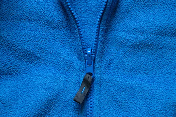 fleece blue sports jacket, artificial fabric as background, fleece sweaters background, tire soft warm fabric as background