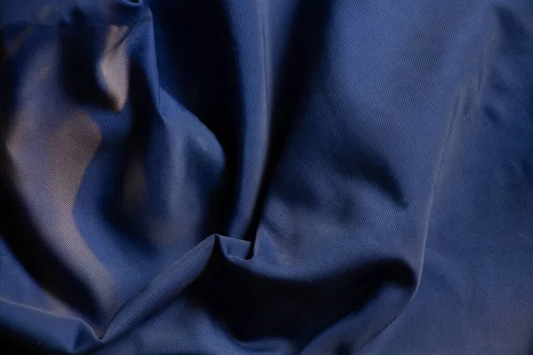 蓝色皱纹布为背景，面料纹理，背景 — 图库照片