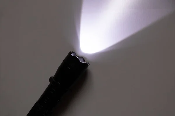 stun gun flashlight to scare off dogs on an isolated background, protection from dogs, schoker