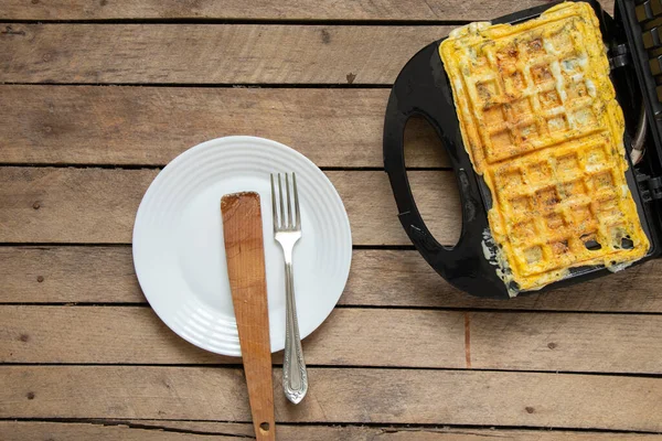 Fry Scrambled Eggs Cheese Spices Waffle Iron Wooden Table Kitchen — Stockfoto