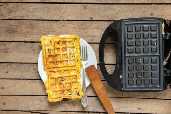Fry Scrambled Eggs Cheese Spices Waffle Iron Wooden Table Kitchen — Stock Photo, Image