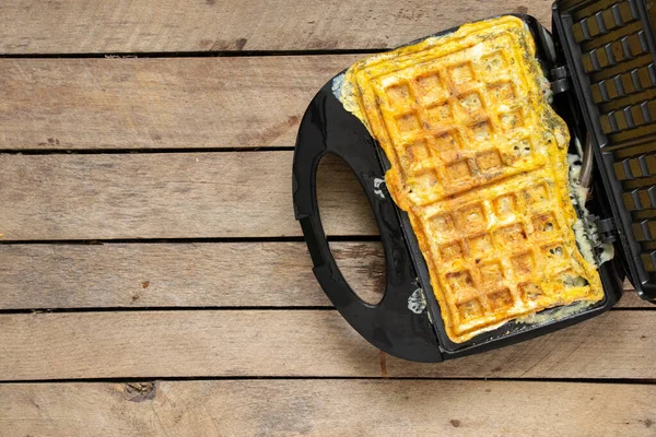 Fry Scrambled Eggs Cheese Spices Waffle Iron Wooden Table Kitchen — Stockfoto