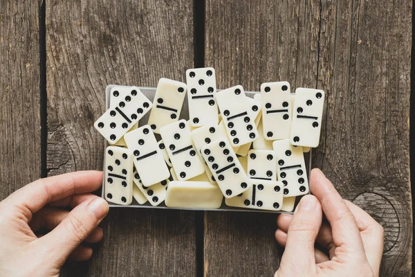 female hand playing dominoes,gambling and hobby