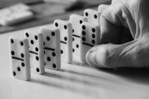 female old hand playing dominoes,gambling and hobby