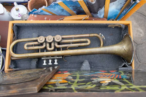 Old musical trumpet in a wooden box close up,music and hobby