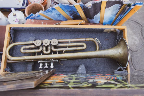 Old musical trumpet in a wooden box close up,music and hobby