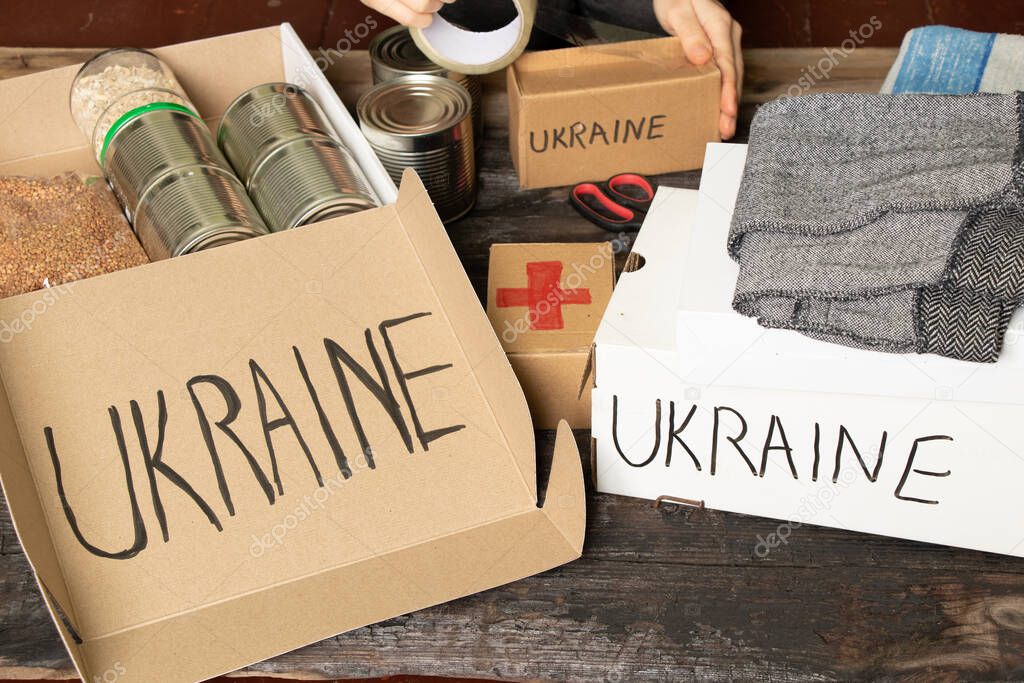 Collecting a humanitarian food set to help people who suffered during the war at the hands of Russia, stop the war in Ukraine, humanitarian aid 2022