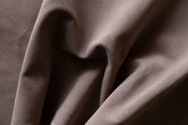Arkaplan için kahverengi kırışık kadife kumaş, arkaplan makro fotoğrafı için kumaş