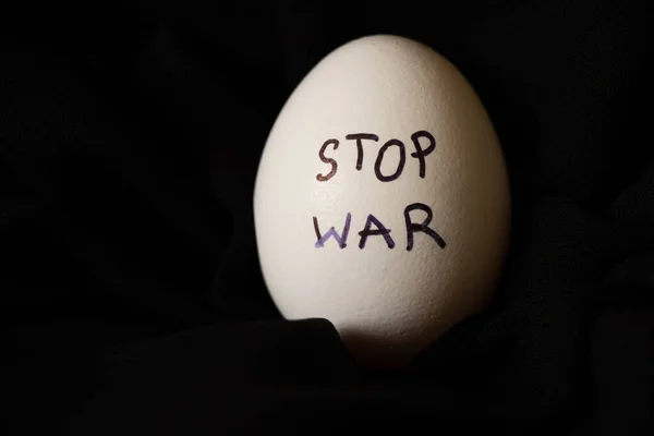 White Chicken Egg Inscription Stop War Which Lies Black Background — Stock Photo, Image