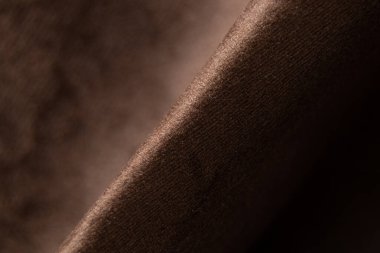 Yumuşak koyu kahverengi buruşuk kumaş makro fotoğraf, döşenmiş mobilya örneği kumaşlar.