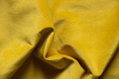 Arka plan olarak yumuşak kadife sarı kumaş, arka plan ve doku, Ukrayna 'yı destekleyen modaya uygun mavi renk