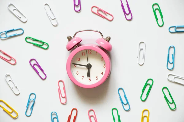 Pink Alarm Clock Multicolored Paper Clips Lies White Background Time — Stockfoto