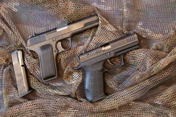 Two Combat Pistols Lie Camouflage Protective Net Military Weapon Pistol — 스톡 사진