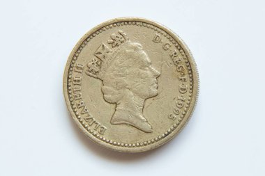 One British pound 1995, old coin on a white background, finance and economics