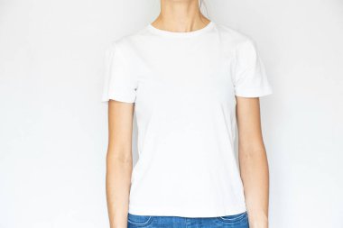 A girl in a white t-shirt on a white background, a place for text, a women's t-shirt on a white, a clothing store