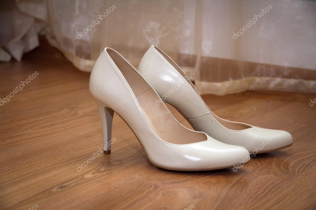 A pair of pale cream-colored wedding 