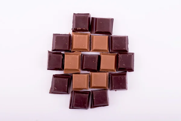 Pieces of dark and milk chocolate — Stock Photo, Image