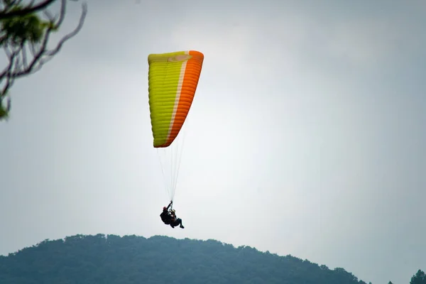 Para Gliding People Bright Orange Yellow Glider Middle Hills Mountains — Photo