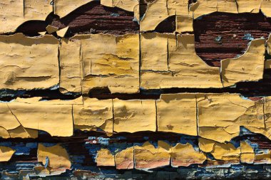 Eski ahşap tahtadaki eski sarı ve mavi boyaların arka planı