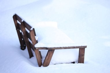 Snow Covered Garden Wooden Bench