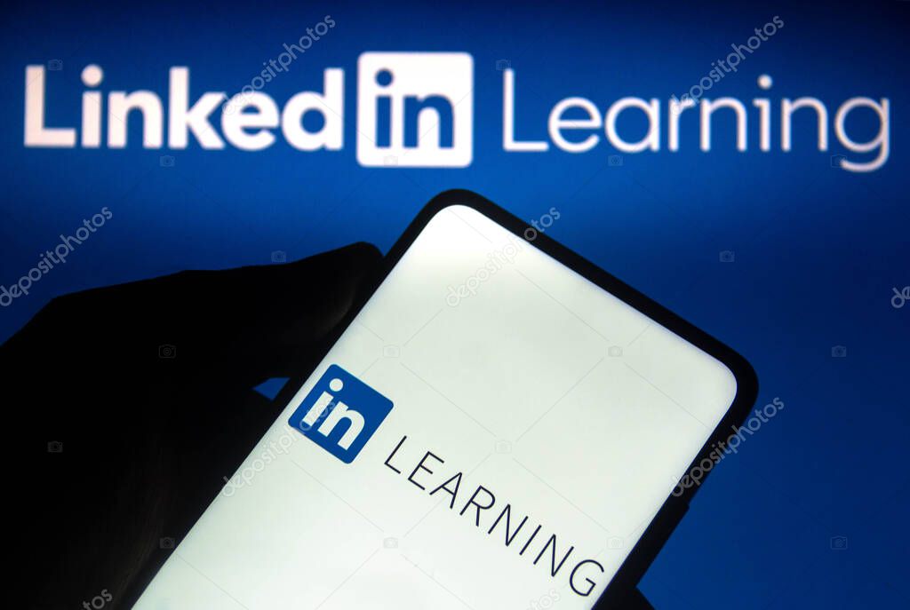 November 1, 2021, Brazil. In this photo illustration the LinkedIn Learning logo seen displayed on a smartphone and on the background