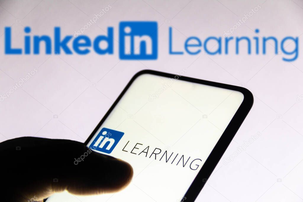 November 1, 2021, Brazil. In this photo illustration the LinkedIn Learning logo seen displayed on a smartphone and on the background