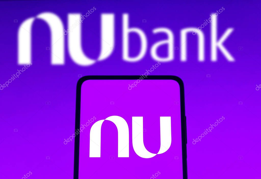November 11, 2021, Brazil. In this photo illustration the Nubank logo seen displayed on a smartphone screen and in the background