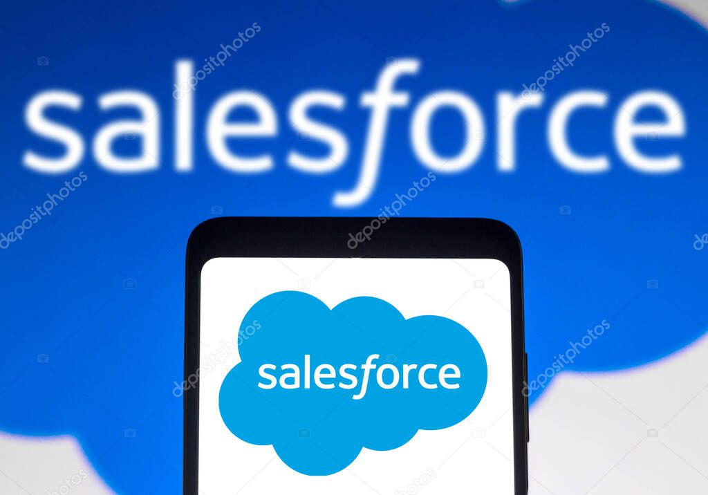 December 14, 2021, Brazil. In this photo illustration the Salesforce logo seen displayed on a smartphone and on the background