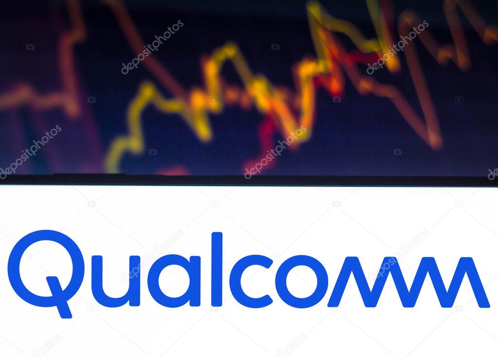 December 14, 2021, Brazil. In this photo illustration, the Qualcomm logo is seen displayed on a smartphone with a stock market graph in the background