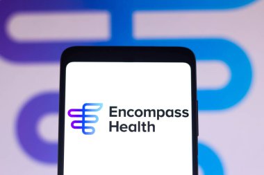 3 Ocak 2022, Brezilya. Bu resimde, Encompass Health Corporation logosu bir akıllı telefon ekranında ve arka planda gösteriliyor.