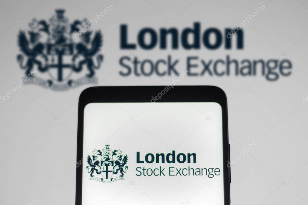 January 4, 2022, Brazil. In this photo illustration, the London Stock Exchange (LSE) logo seen displayed on a smartphone screen and in the background