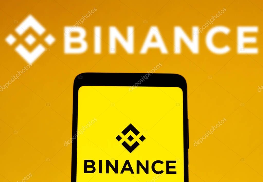 February 1, 2022, Brazil. In this photo illustration, the Binance logo is displayed on a smartphone screen and in the background
