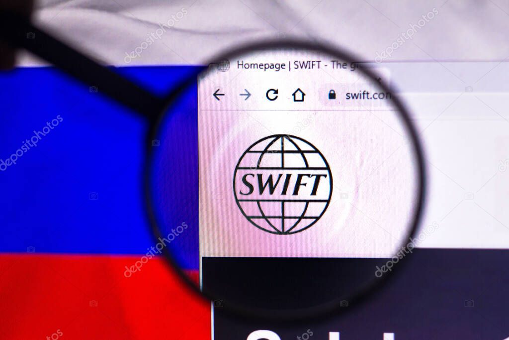 February 22, 2022, Brazil. In this photo illustration, the Society for Worldwide Interbank Financial Telecommunication (SWIFT) logo seen displayed on a computer screen through a magnifying glass