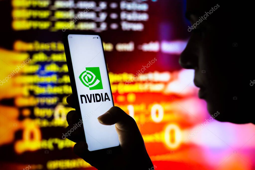 April 10, 2022, Brazil. In this photo illustration, a woman holds a smartphone with the Nvidia Corporation logo displayed on the screen