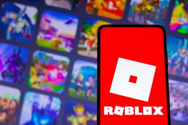 April 26, 2022, Brazil. In this photo illustration the Roblox logo seen displayed on a smartphone clipart