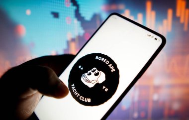 May 7, 2022, Brazil. In this photo illustration, the Bored Ape Yacht Club logo seen displayed on a smartphone