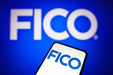 May 16, 2022, Brazil. In this photo illustration the Fair, Isaac and Company (FICO) logo seen displayed on a smartphone and in the background