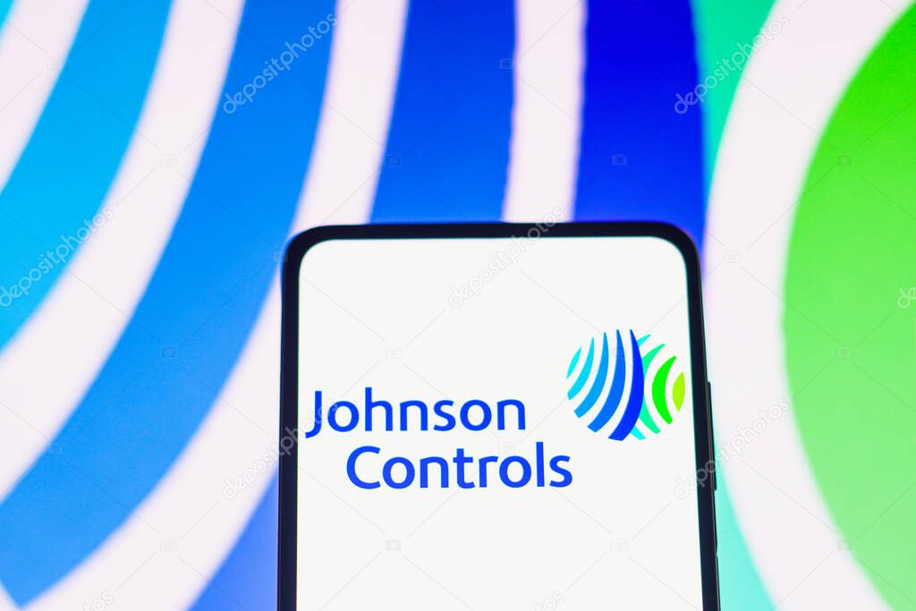 June 7, 2022, Brazil. In this photo illustration, the Johnson Controls logo is displayed on a smartphone screen and in the background